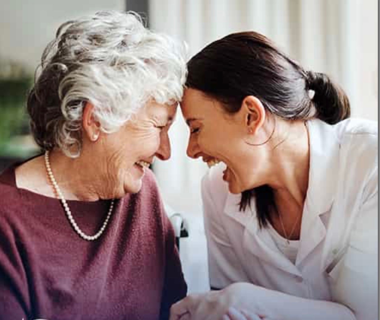 Senior resident spending time with companion while reading